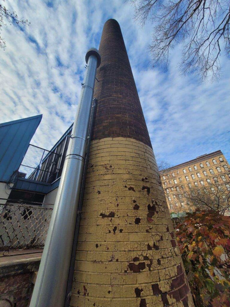 Chimney service being provided by Stapleton Roofing professionals