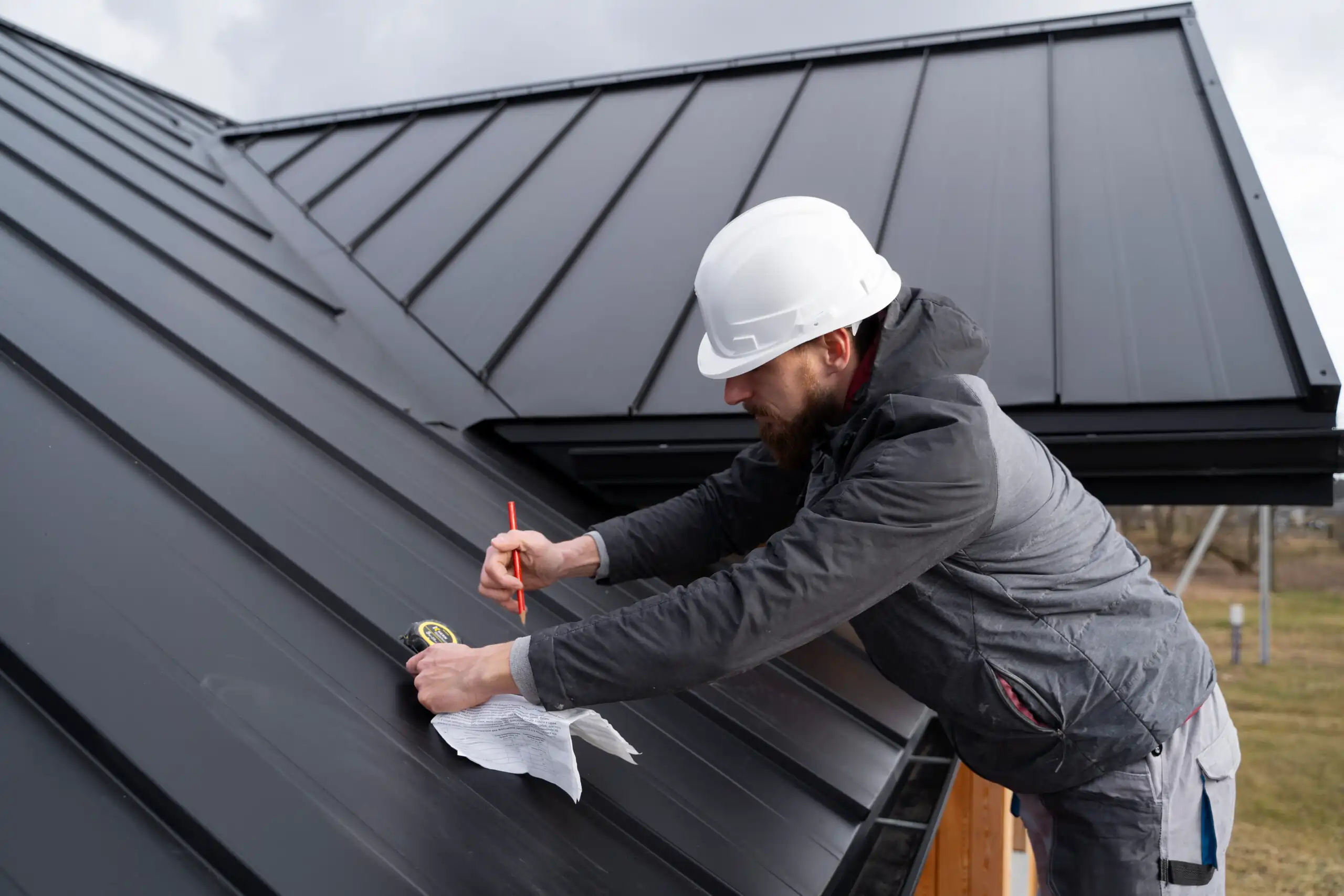 Professional roof installation in progress on a residential home during summer 2025