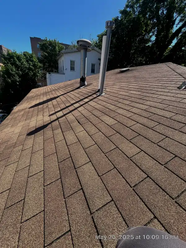 Asphalt shingle installation shown on a residential rooftop, representing one of the most common types of roofing used in New York homes.