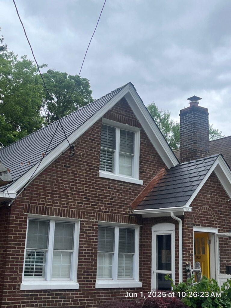New metal roofing on brick house in New York.